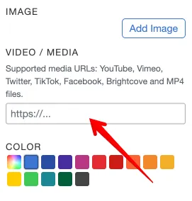 Screenshot of the MapHub editor&#x27;s right-side panel, highlighting the &#x27;Video / Media&#x27; input field with a red arrow, where users can paste a media URL to embed content for an item.