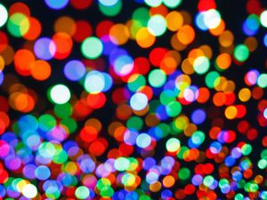 An abstract header image showing out-of-focus colorful bokeh lights, which represent the simplified data points on a dense, interactive map. helps declutter the view for a better user experience.
