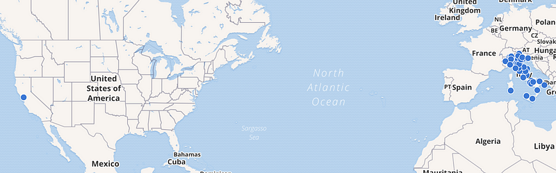 A world map showing a single point in San Francisco, USA and many points clustered around Italy, illustrating a wide default map view before setting a start view.