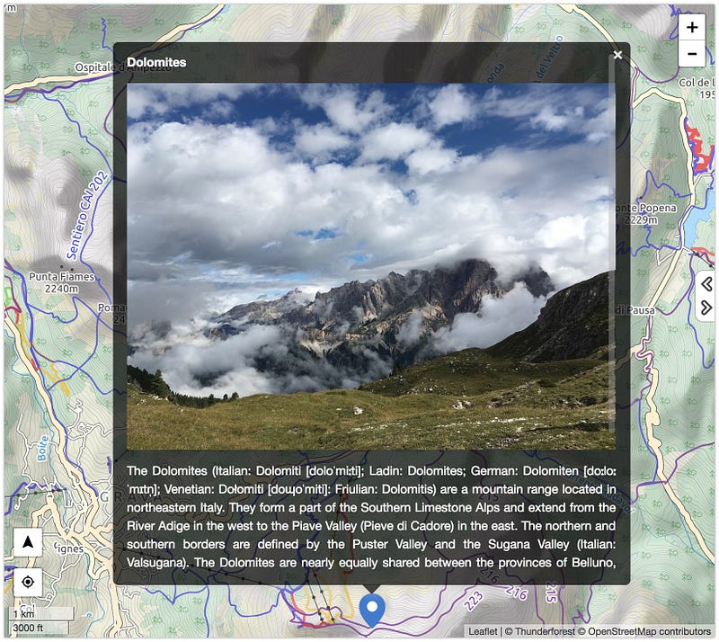 Desktop view of a MapHub map with a large popup displaying a high-resolution image of the Dolomites and descriptive text, illustrating the improved popup size.