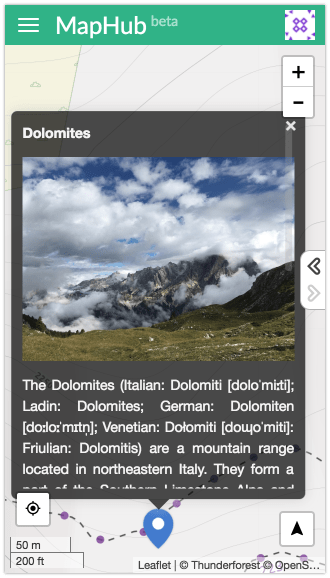 Mobile view of a MapHub map showing a full-height, scrollable popup displaying an image and description of the Dolomites, demonstrating optimized mobile popup design.